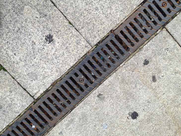 Ulma trench drain, sidewalk trench drain, iron grates, architectural grating, decorative grates, sidewalk drains